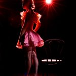 Cabaret Dancer on stage, silouetted against the stage lights